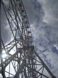 Low angle view of ferris wheel against sky