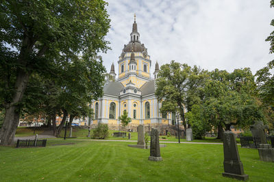 A panoramic view of the st. mary magdalene church from the cemetery park