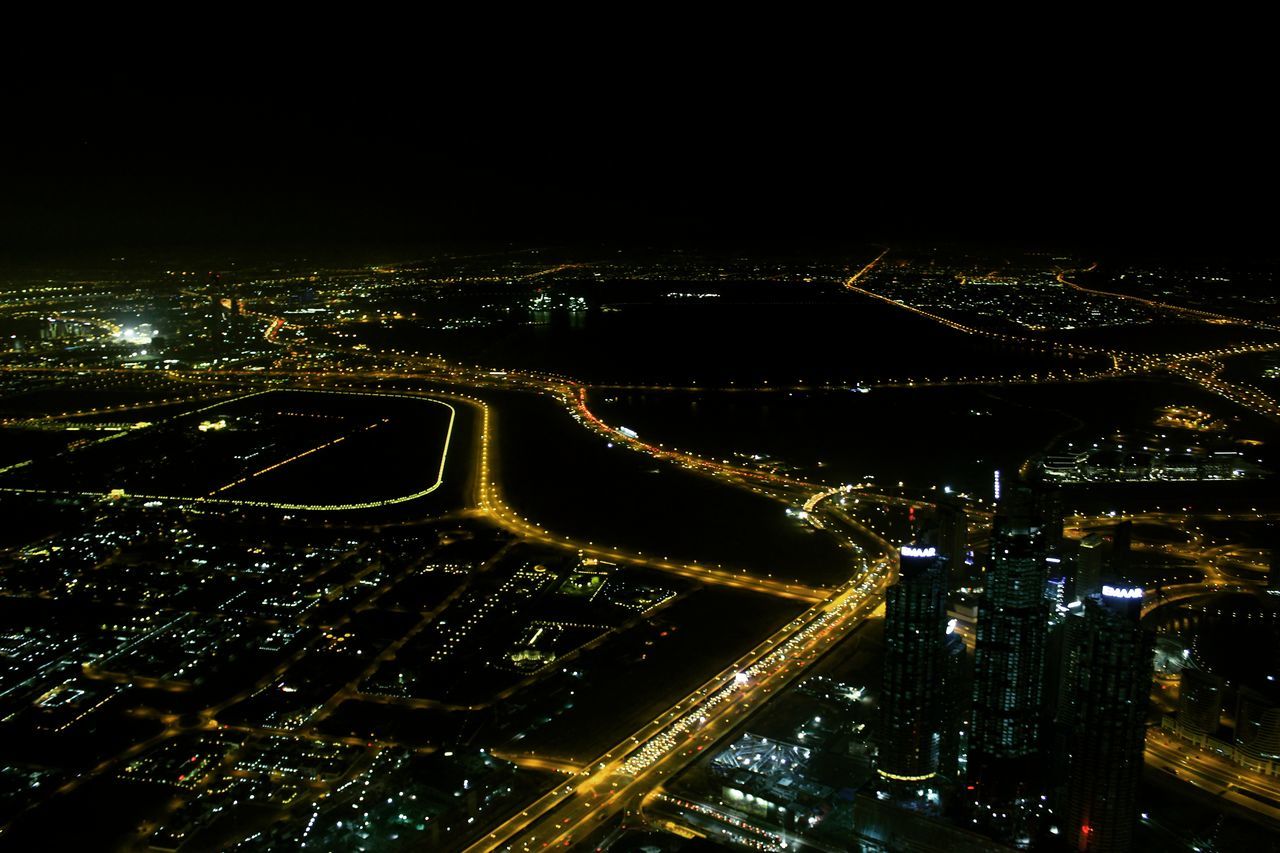 AERIAL VIEW OF ILLUMINATED CITY