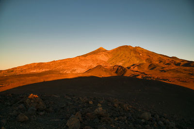 Scenic view of desert against clear sky