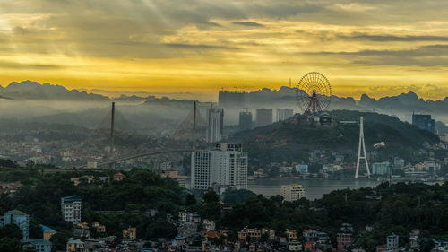 High angle view of city buildings during sunset