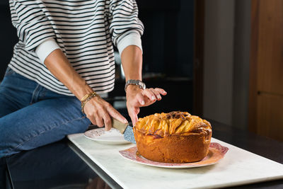 Midsection of man preparing food