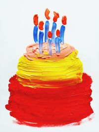 Close-up of multi colored candies against white background