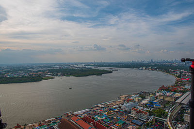 High angle view of city against cloudy sky