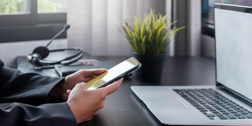 Man using laptop on table