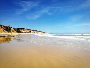 Scenic view of beach against sky