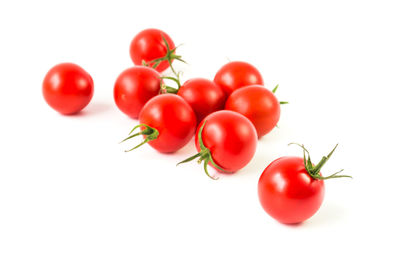 Close-up of cherry tomatoes against white background