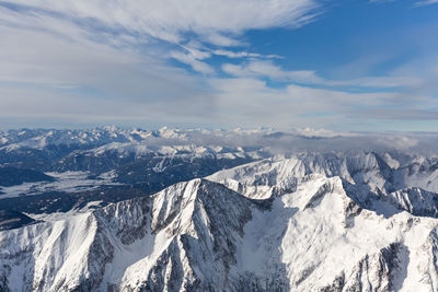 Scenic view of snowcapped mountains against sky