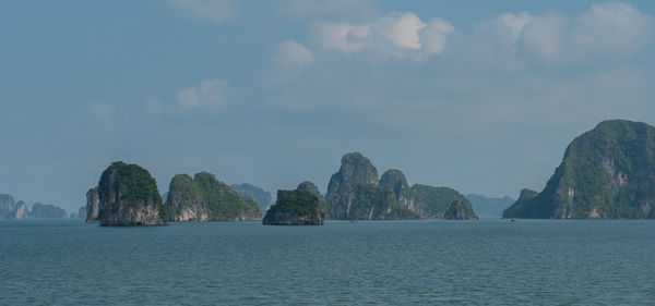 Panoramic view of sea and mountains against sky