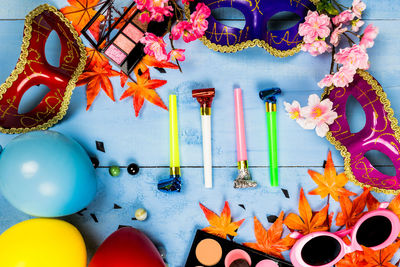 Close-up of multi colored umbrellas on table