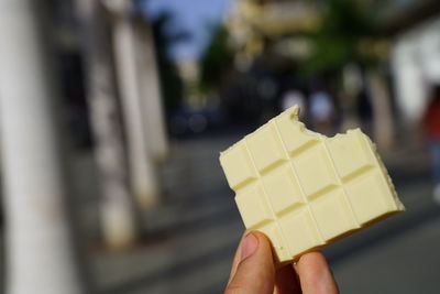 Close-up of hand holding ice cream