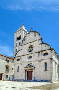 Low angle view of building against blue sky