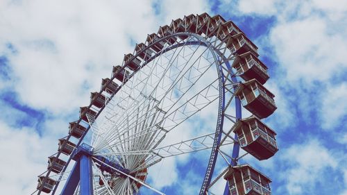 Low angle view of ferris wheel against sky