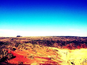 Scenic view of landscape against clear blue sky