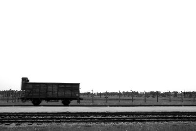 Railroad tracks against clear sky