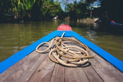 Close-up of rope tied on pier