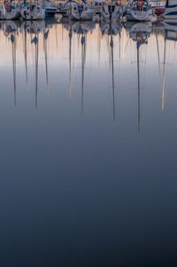 Reflection of sailboats in lake