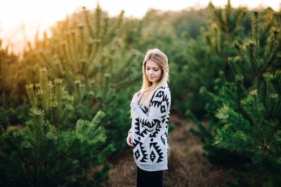 Portrait of young woman in forest