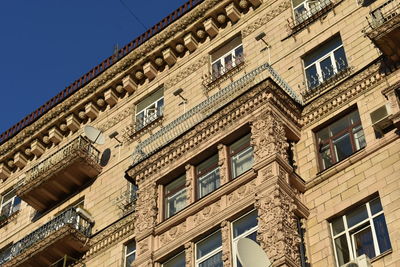 Low angle view of building against blue sky