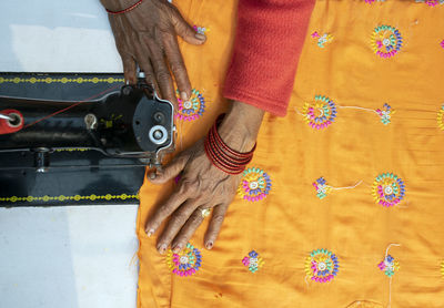 Close-up of woman working on sewing machine