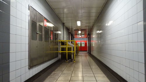 Rear view of man walking in subway