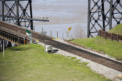  train traffic speed limit 10 miles per hour and do not throw trash off bridge sign at  train tracks