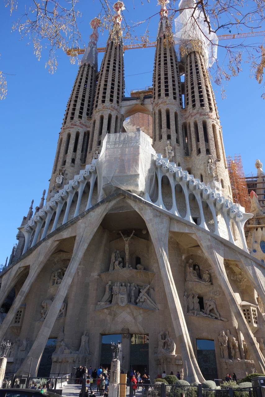 architecture, built structure, building exterior, low angle view, clear sky, blue, sunlight, famous place, travel destinations, day, city, outdoors, building, tourism, history, sky, travel, international landmark, capital cities, no people