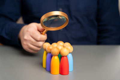 Midsection of man holding pills