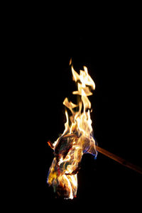 Close-up of bonfire against black background