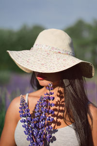 Rear view of woman wearing hat