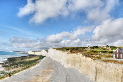 View of beach against cloudy sky