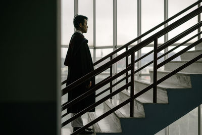 Low angle view of man standing on steps