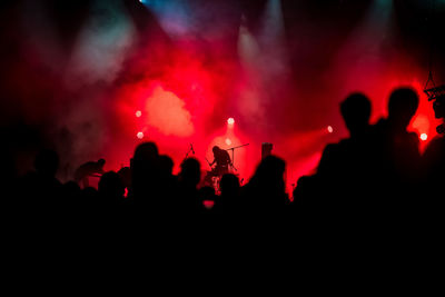 Silhouette people at music concert