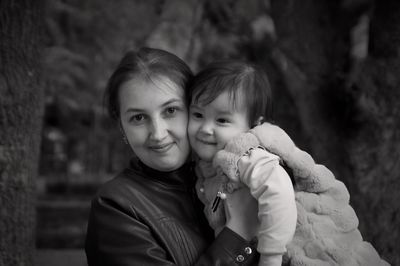 Portrait of woman with daughter