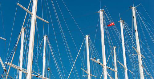 Ship mast in the port of bodrum, turkey in front of cloudless sky