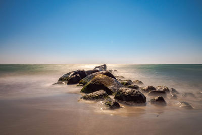 Scenic view of sea against clear sky