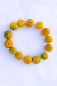 High angle view of fruits against white background