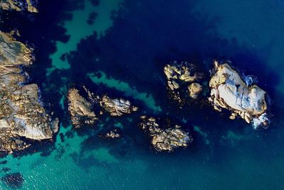 High angle view of rocks in sea