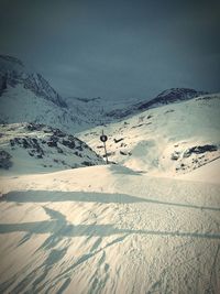 Scenic view of snow covered mountain against sky