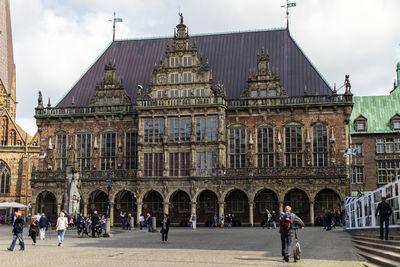 Group of people in front of historical building