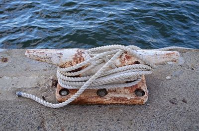 High angle view of rope tied to boat