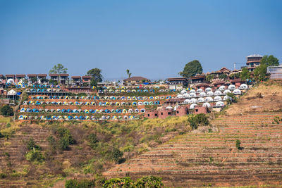 Panoramic shot of buildings against clear sky