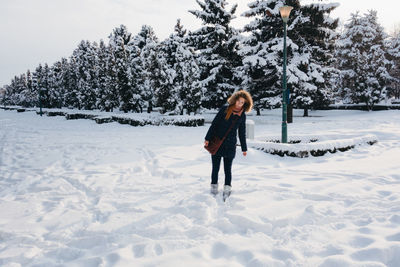 Full length of person on snow covered field