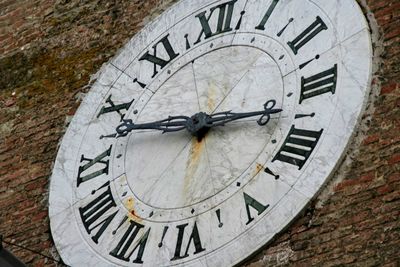 Close-up of clock on wall