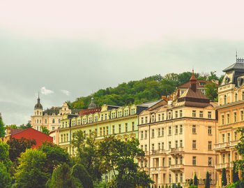 Buildings in city against sky