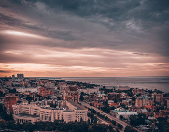 High angle shot of townscape against sky at sunset