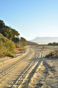 Scenic view of road against clear sky