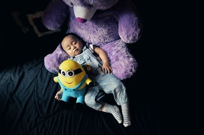 High angle view of baby boy sleeping on bed at home