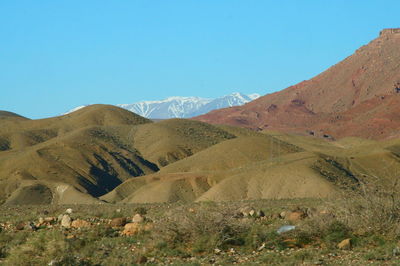 Scenic view of mountains against clear blue sky