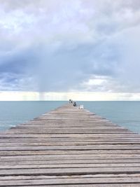 Pier over sea against sky